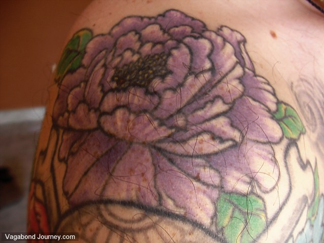 This tattoo of a peony flower I received in Bangkok, Thailand.