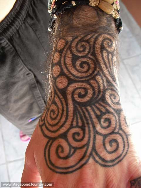 Hand tattoo done in Bangkok Thailand by Mr. Tung in the Khao San Road 