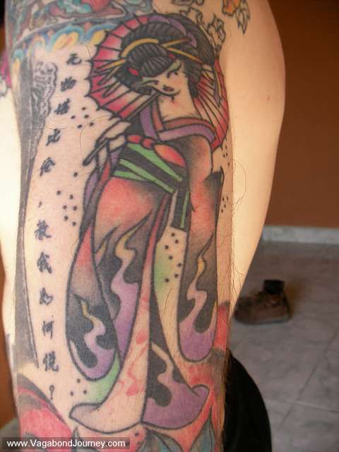 Japanese tattoo of a geisha (or dancing girl) done by Madoka of Cat Claw 