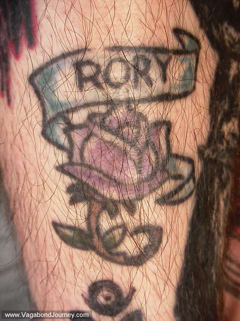 tattoo,banner tattoo,ribbon tattoo,daisy tattoo design,daisy with banner