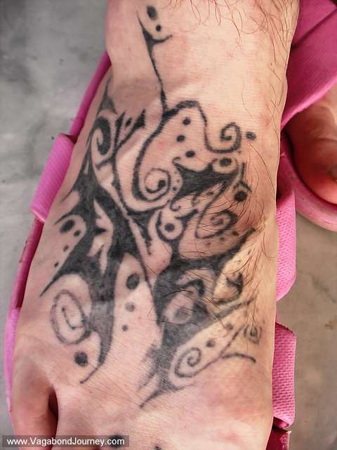 Photo of a Tibetan Tattoo design in progress. It is being done in a tattoo