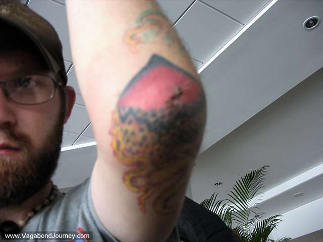 Another photo of Erik the Pilot's broken hearted tattoo.