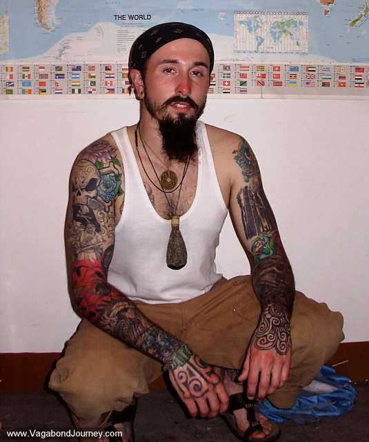 Wade from Vagabond Journeycom showing off his tattoos in China in 2006