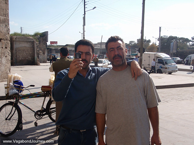 syrian men with cell phone