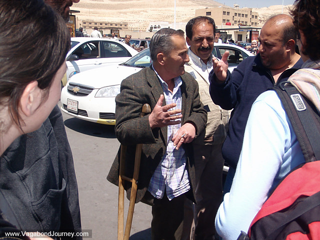 taxi drivers discuss prices from damascus to amman