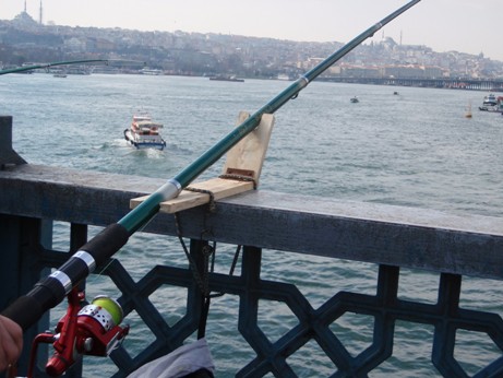 Wood Fishing Rod Holder Fishing pole holder for fishing over a bridge.