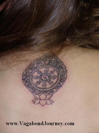  China tattoo artist Yujin working on the lotus flower tattoo on my elbow 