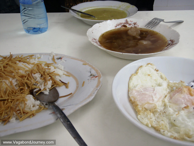 iraqi breakfast: pea soup, chicken, eggs, rice, noodles