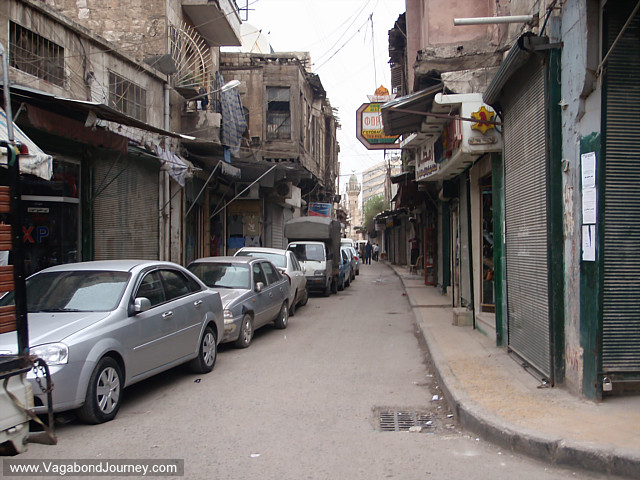 cars in narrow alley of aleppo